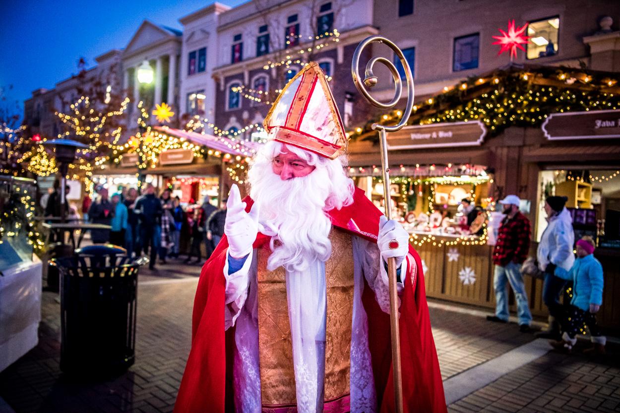 after photo of man dressed in christian bishop/santa attire